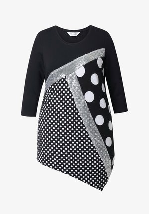 Czarna tunika z mieszanką dużych i małych białych kropek, srebrnymi akcentami i ukośnym wzorem o zróżnicowanych motywach.