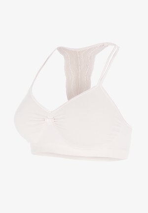 Helle beige kabellose BH mit V-Ausschnitt, einem dekorativen Bogen in der Mitte und Spitzenakzenten an den Racerback-Trägern. Glatte Textur.