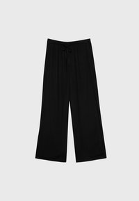 Pantalon noir à jambes larges en tissu doux, avec une taille élastique et un cordon de serrage. Texture lisse et design fluide.