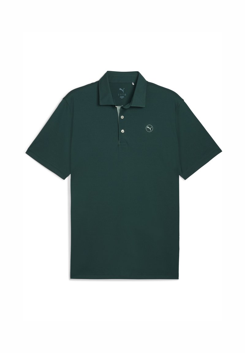 Mörkgrön polo med krage och två knappar, med en liten rund logotyp på vänster bröstområde.