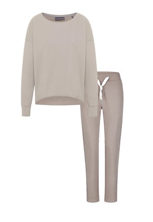 Light beige long-sleeve top with a rounded neckline and relaxed fit, paired with matching tapered pants featuring an elastic waistband and drawstring.