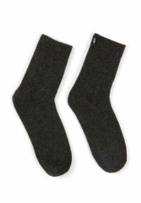 Mörkgrå strumpor tillverkade av ett mjukt, strukturerat tyg. De har en ribbad mudg och en liten svart märkesetikett i toppen.