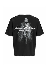T-shirt noir avec un graphisme d'un bateau créant un sillage sur l'eau et les textes "Island Retreat" et "Support Your Body" dans le dos.