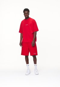 Pegador LOGO - Shorts - washed red/white gum