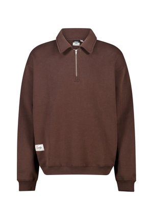 Brown long-sleeve pullover with half-zip collar, ribbed cuffs and hem, and a small white brand label near the left hem.