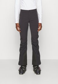 Zwarte broek met een aansluitend ontwerp, gemaakt van duurzaam materiaal, met een gladde textuur, twee knopen bij de taille en contrasterende zwarte panelen bij de enkels.