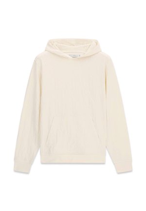 Krémová mikina s kapucňou z mäkkej látky. Má predné vrecko, rebrované manžety a kapucňu so šnúrkami. Hladká textúra a voľný strih.