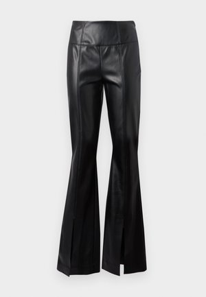 Black faux leather high-waist pants with vertical seam details and front slits at the flared hem against a plain white background.