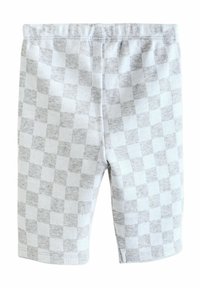 Grå og hvid ternede shorts lavet af en blød bomuldsblanding. Har en elastisk talje og syede kanter.
