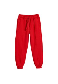 Pantalones de chándal rojos con cintura elástica y cordón de ajuste, que presentan bolsillos laterales y puños ajustados en los tobillos. Textura de tela suave.