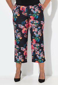 Bloemenprint broeken in donker marineblauw, met felle roze, gele en blauwe bloemen. Verkort, met zijzakken en een comfortabele tailleband.