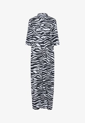 Sukienka w czarno-biały wzór zebry z guzikiem z przodu, kołnierzykiem i rękawami o długości trzy czwarte. Posiada przewiązywany pas dla regulowanego dopasowania.