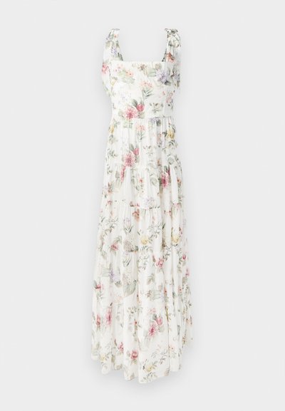 Floral maxi dress made of lightweight fabric. Features square neckline, adjustable tie straps, and tiered, flowing silhouette in pastel colors.