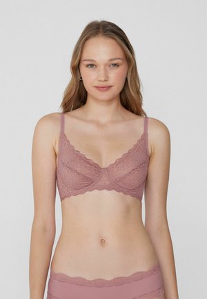 Krajková podprsenka v jemné mauve barvě s vlnkovými okraji a nastavitelnými ramínky. Obsahuje květinový vzor a klasický design s kosticemi.