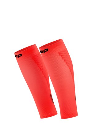 Pair of bright red compression calf sleeves with black logo accents, designed for athletic use and muscle support.