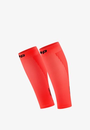 Pair of bright red compression calf sleeves with black logo accents, designed for athletic use and muscle support.