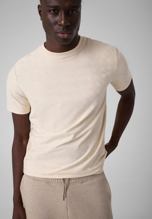 Guess, BEDRUCKTES T-SHIRT - T-shirt imprimé - creme