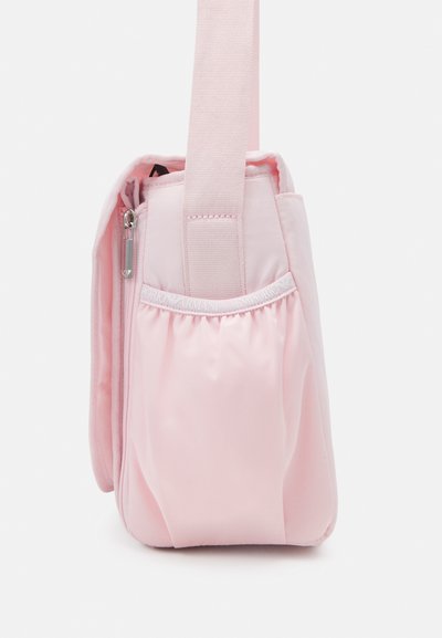 Pink fabric shoulder bag with a zip closure, padded texture, adjustable strap, and gathered detail on one side.