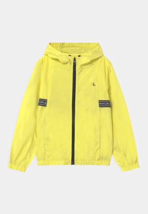 LOGO TAPE UNISEX - Light jacket - yellow