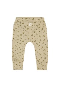 Pantalon en coton beige clair avec un motif d'animaux et de plantes vert à motifs intégral. Il dispose d'une taille douce et de chevilles resserrées.
