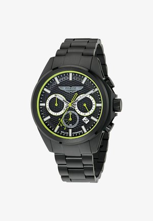 Schwarze Edelstahl-Uhr mit strukturiertem schwarzem Zifferblatt, weißen und grünen Akzenten, drei Hilfszifferblättern und Datumsanzeige. Solarbetriebene Funktion hervorgehoben.