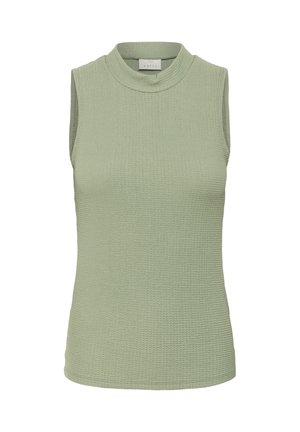 Ärmlös topp i mjuk grön färg med ett strukturerat tyg och ett räfflat mönster. Halsringningen är hög och rundad, vilket ger en figurnära look.