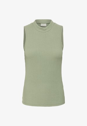 Mouwloos topje in zacht groen, met een textuurstof en een geribbelde structuur. De halslijn is hoog en rond, wat zorgt voor een getailleerde uitstraling.