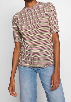 Person wearing a short-sleeve fitted top with horizontal stripes in pink, green, white, and black, paired with light blue denim jeans.