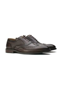 Brown leather dress shoes with brogue detailing, round toe, and lace-up design. Features a smooth texture and wooden heel accents.
