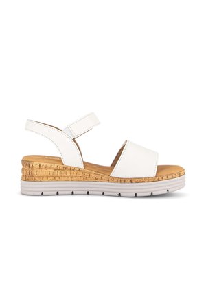 White open-toe wedge sandal with cork midsole, adjustable ankle strap, and light gray rubber outsole on a white background.