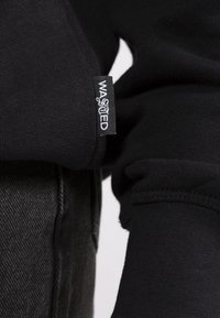 Wasted Paris Jersey con capucha - black