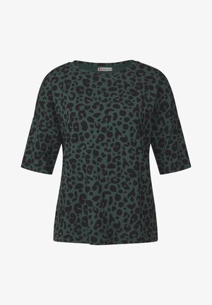 Green shirt with a loose fit and short sleeves, featuring a black leopard print pattern. Made from soft fabric with a round neckline.