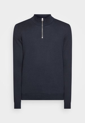 Dunkelblauer Pullover mit hohem Kragen und halbem Reißverschluss. Aus weichem Material gefertigt, mit gerippten Bündchen und Saum für eine taillierte Passform.