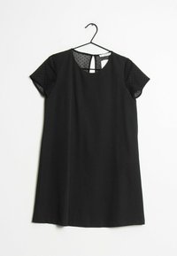 Robe noire avec manches courtes transparentes à pois, encolure ronde et légère forme évasée. Elle présente un dos avec une ouverture en forme de clé et un tissu lisse.