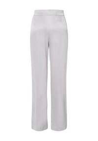 Pantalons larges gris clair en tissu lisse et doux. Dotés d'une taille élastique. Design simple sans motifs ni accents supplémentaires.