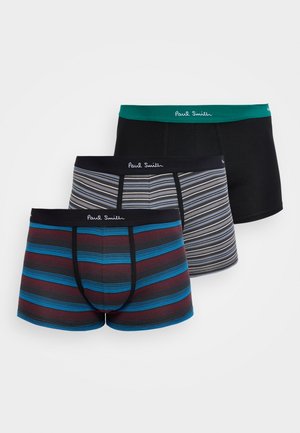 Trois boxers pour hommes, un noir uni avec ceinture verte, deux rayés avec ceintures bleu marine, tous de la marque Paul Smith.