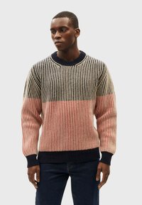 Knit sweater featuring horizontal stripes in navy, cream, and coral. Ribbed crew neckline and cuffs with textured fabric. Casual fit.
