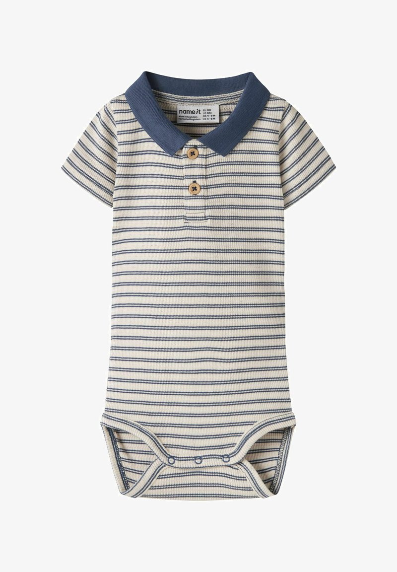 Body bébé rayé crème et marine, avec un col polo, trois boutons en bois et des pressions à l'entrejambe. Tissu doux et texturé.