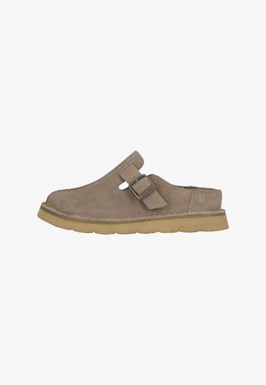 Suede clogs in light brown with a rounded toe, open back, adjustable buckle, and a textured rubber sole. Simple, functional design.