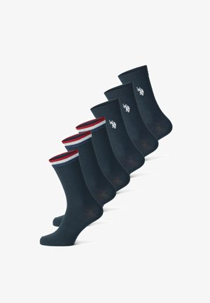 Mornarske nogavice, mešanica bombaža, dolžina do pol kalfa, rebrast rob s rdečimi in modrimi črtami, vezen logotip, set petih nogavic.