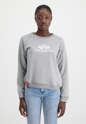 Gray sweatshirt with a crew neckline, featuring a white logo and triangle design on the front, and a red label on the hem.
