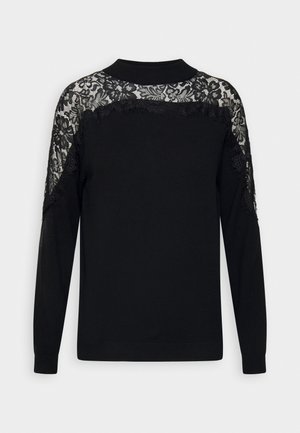 Schwarzer Pullover mit langen Ärmeln, Rundhalsausschnitt und filigranen schwarzen Spitzenverzierungen an der Schulter und im oberen Rücken.