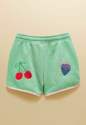 Mündirohelised lühikesed püksid elastse vöökohaga, roosade ääristega, vasakul jalal punase kirsikirjaga ja paremal jalal sinise maasikakirjaga.