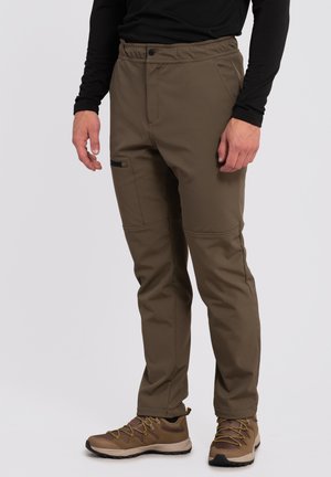 Brown hiking pants made of durable material with a zippered pocket. Features a relaxed fit and elastic waistband for comfort.