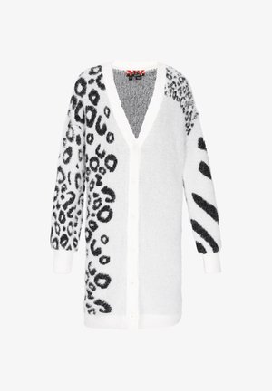 Cardigan blanc avec imprimé animal noir d'un côté et motifs abstraits noirs de l'autre. Texture douce et duveteuse ; boutonnage à l'avant et décolleté en V.