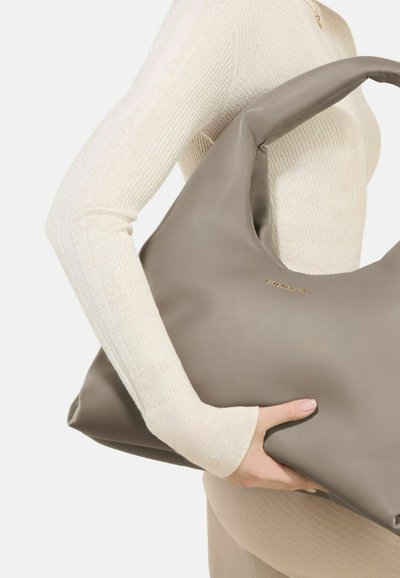 Gray leather hobo bag with a smooth texture, large, curvy shape, and a subtle gold logo accent on the front.