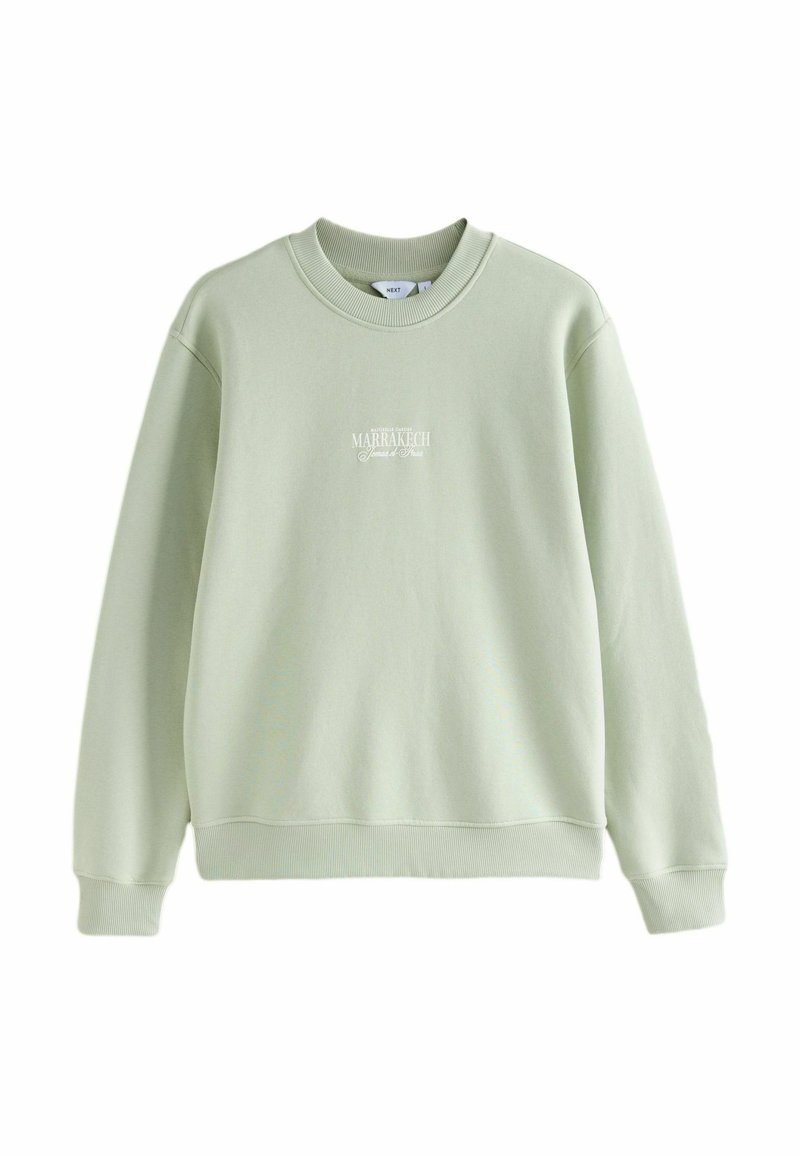 Light green sweatshirt made of soft fabric. Crew neckline, long sleeves, ribbed cuffs and hem. Features white printed text on the front.