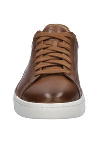 Brown leather sneaker with rounded toe, white rubber sole, and woven beige laces. Smooth texture with subtle stitching details.