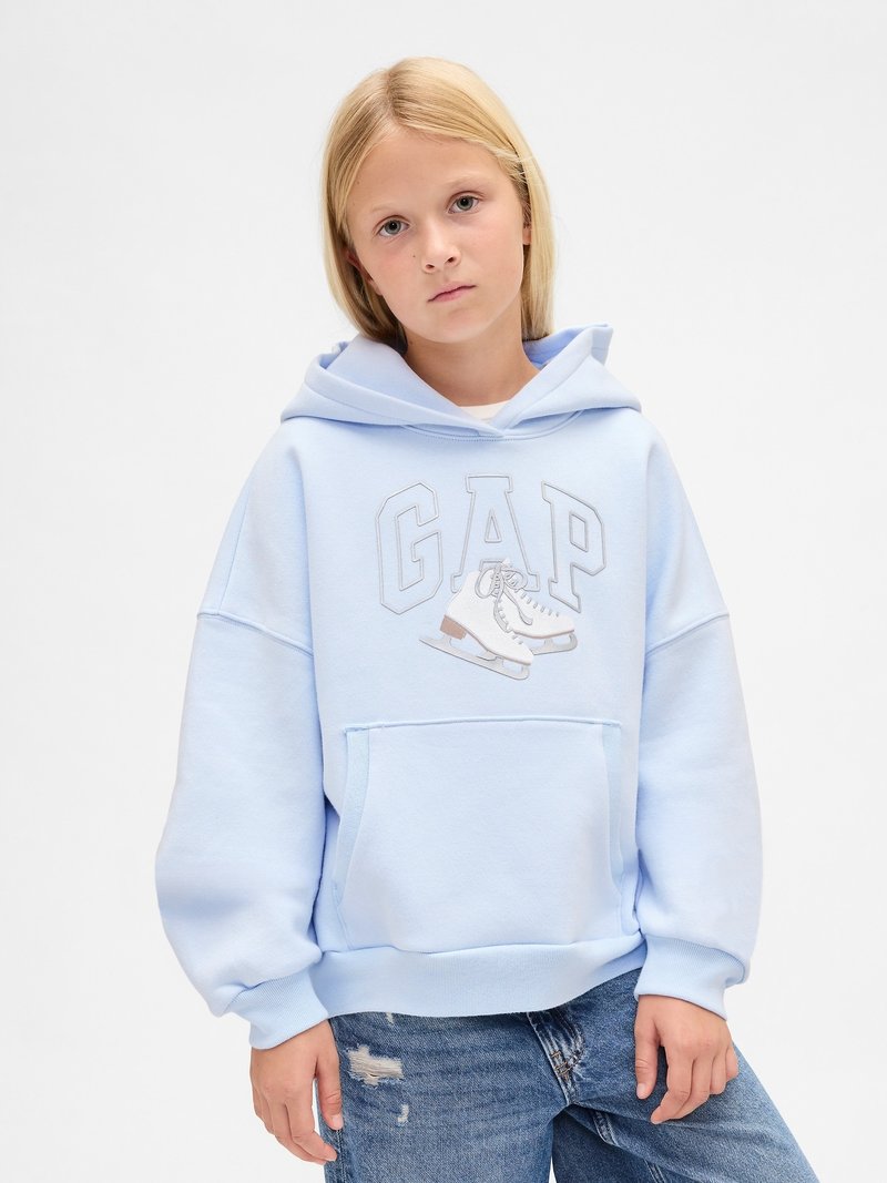 Light blue hoodie with a graphic featuring ice skates and the word "GAP." Soft material, oversized fit, front pocket, and ribbed cuffs.