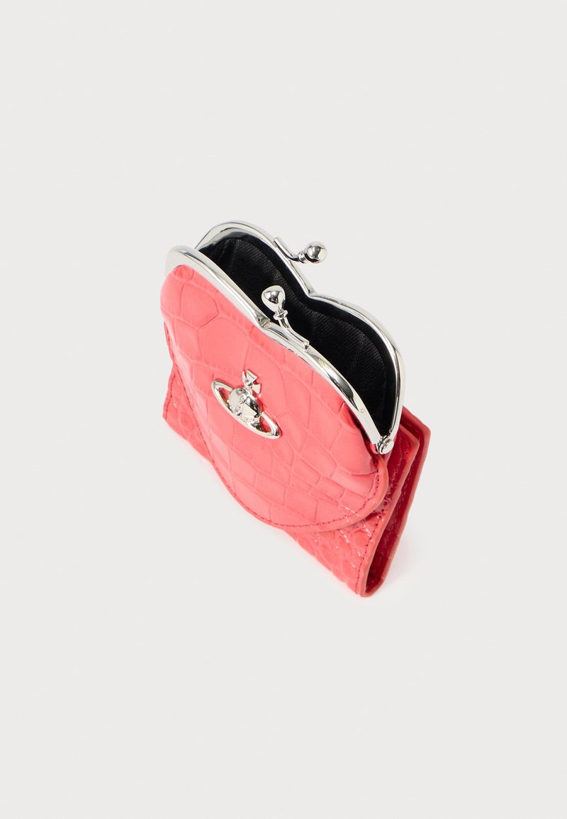 Pink faux-crocodile leather wallet with a silver-tone kiss-lock closure, featuring a heart-shaped design and black fabric interior.